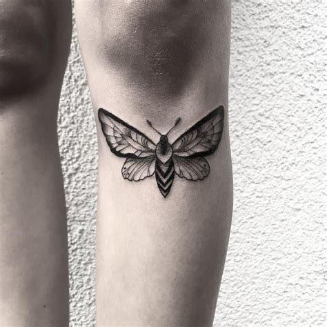 minimalist moth tattoo